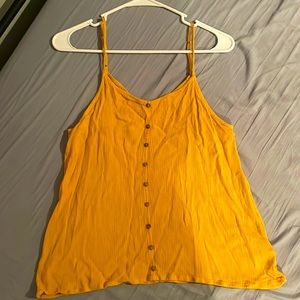 Medium SO Yellow colored tank top with buttons.